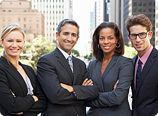 Four HR Professionals standing outside of office building