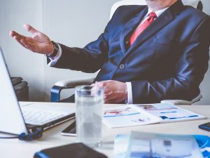 Interview with business man sitting at office desk