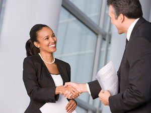 Professional woman arrives to the offices of The AGA Group for interview. 