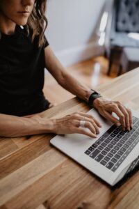 Female with a laptop applying for a job on her laptop computer