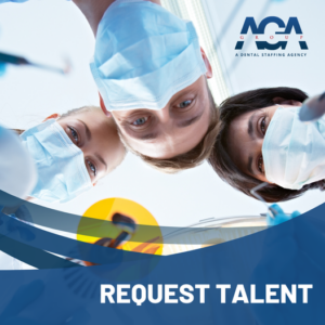 Dental professionals standing over a patient.
