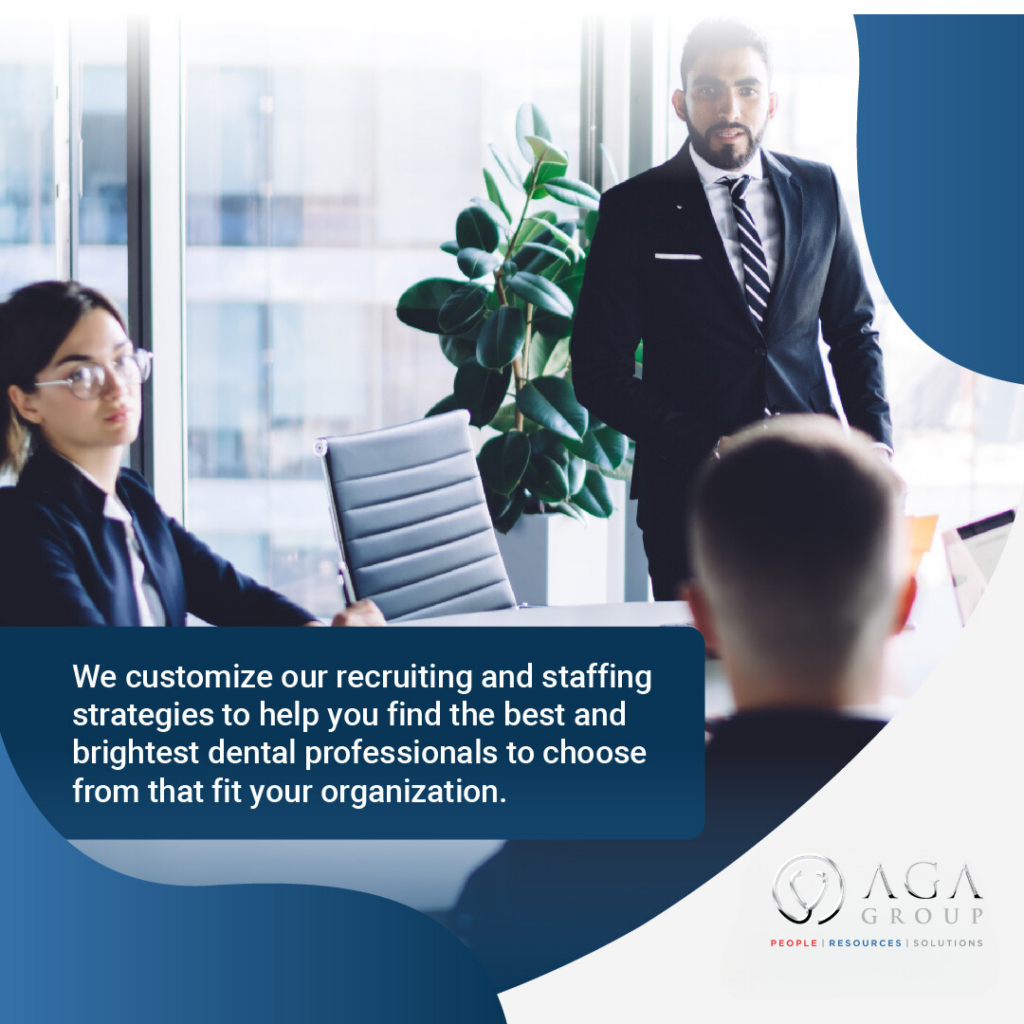Employee discussing healthcare retention strategies in a meeting. Three individuals in a modern office. The image includes a male presenter in a suit addressing two colleagues. Text overlay reads, "We customize our recruiting and staffing strategies to help you find the best and brightest dental professionals to fit your organization." The AGA Group logo appears in the bottom right corner, emphasizing their expertise in dental staffing solutions.